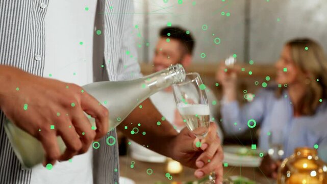 Standing host starting pour into flute, guests raising glasses during dinner toast, green overlay