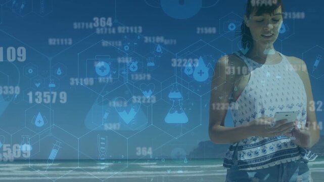 Woman walking shoreline, tapping smartphone, checking health metrics, activating hex grid HUD