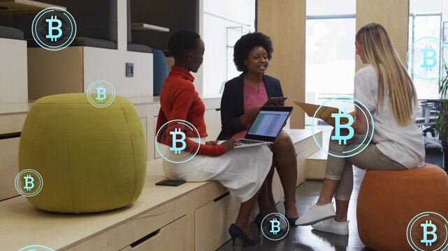 Lead speaker gesturing tablet sparking B icons while team scrolling laptop using folder for finance
