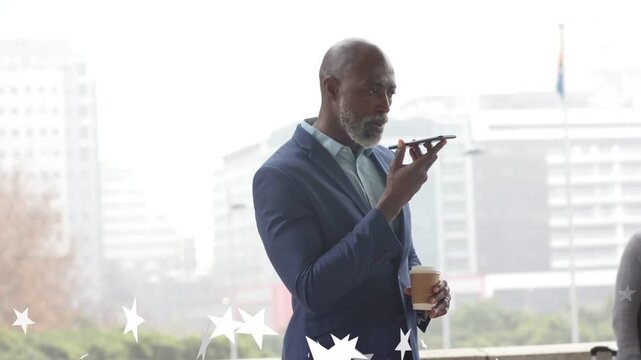 Senior businessman raising phone to mouth at parapet, making business call while stars appearing