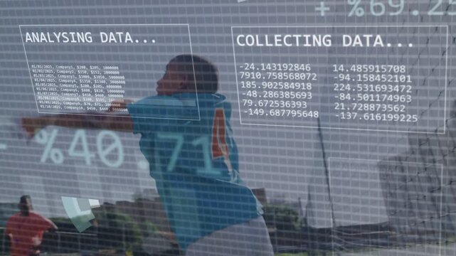 Boy lifting soccer ball and launching throw on training pitch, coach observing, HUD charts syncing