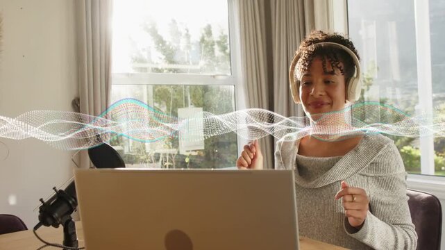 Woman creator tapping laptop touchpad, starting playback for monitoring audio, waveform pulsing