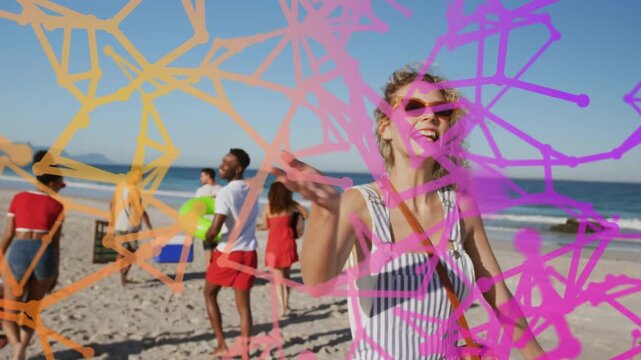 Woman laughing, waving while confetti appearing few frames in, friends walking to sea, marketing