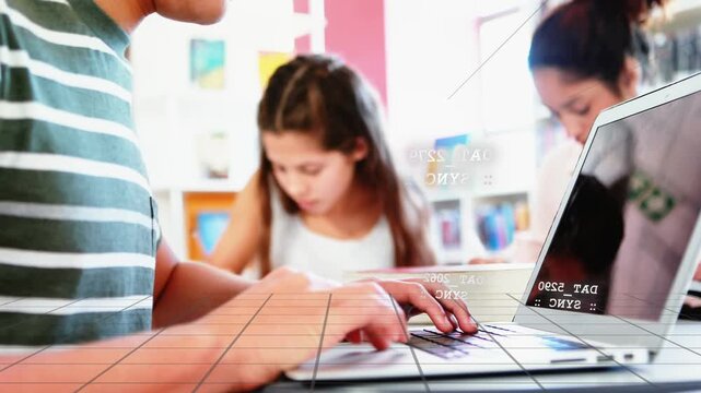 Foreground student typing on laptop, touching trackpad and starting data grid overlay for classwork