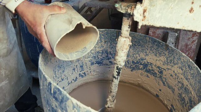 Clay Mud Swirling in an Industrial Ceramic Studio Mixer