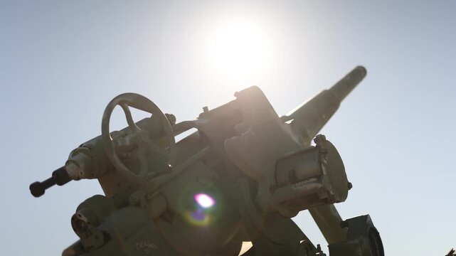 Artillery cannon close up heavy military equipment metal surface texture industrial power war concept strong visual detail