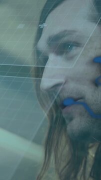 Vertical video: Man holding paper cup bringing it forward, following grid UI and reading tech data