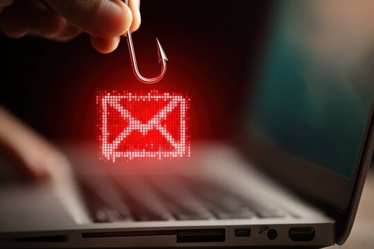 a close up, eye level shot shows a digitally rendered red fishhook, dangling from above, with a red pixelated email icon with a white outline being held by a light skinned hand Generative AI