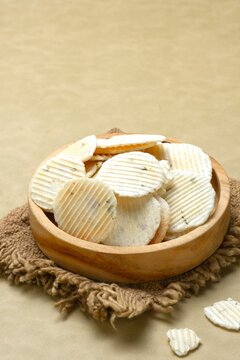 Kue gapit or Kue sempromg asin, Gapit Crackers on plate. Gapit cake is a typical Cirebon snack that is crispy and savory, 