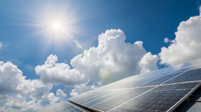 Solar Panels Under Bright Sunshine with Fluffy Clouds in Blue Sky, Renewable Energy Concept for a Sustainable Future