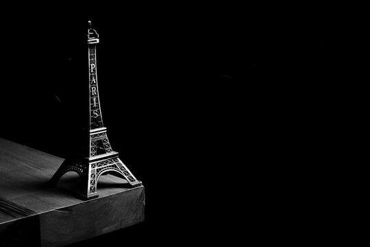 Eiffel Tower miniature with dramatic low key lighting