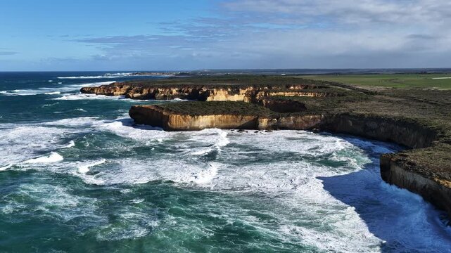 Great Ocean Road, Peterborough, Victoria, Australia: 4K aerial drone footage of London Arch (Bridge), Port Campbell National Park, limestone cliffs, ocean waves, rock formations, rugged coastline