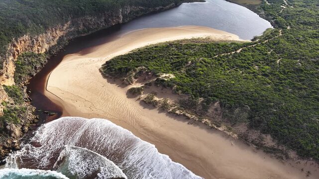 Princetown Beach, Victoria, Australia: 4K aerial drone footage of Gellibrand River mouth, sandy beach, ocean waves, forest, cliffs and coastal landscape.