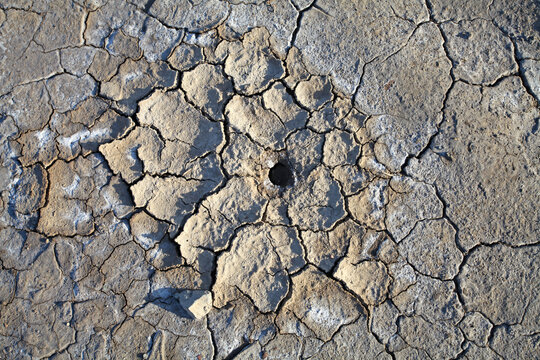 Cracked Land Texture with Hole in Arid Environment