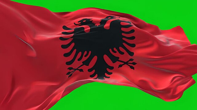 Albanian flag waving in the wind on a green screen background.