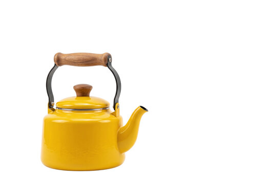 Bright yellow whistling tea kettle with wooden handle