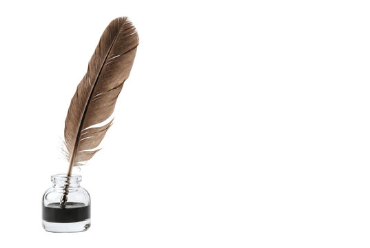 Traditional brown feather quill pen in a glass inkwell