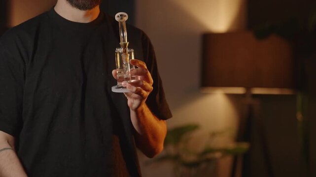 A man smoking Marijuana, half body shot