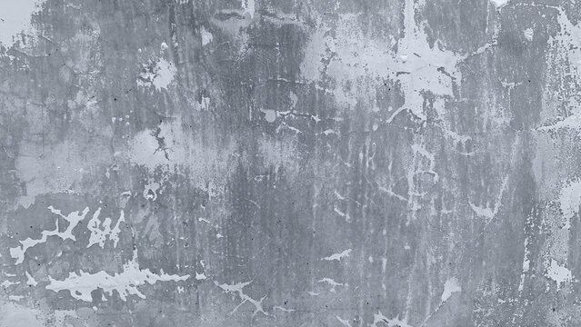​Grungy abstract background of weathered white paint peeling off a grey concrete wall surface with cracks and stains