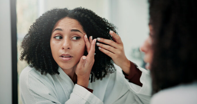Woman, skincare and check face in mirror with inspection, beauty and search for pimples in bathroom. Female person, acne evaluation and dermatology in house with reflection, self care and grooming.