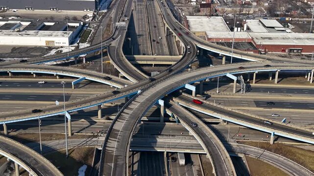Aerial view of cars driving on a complex highway interchange in Detroit, Michigan.