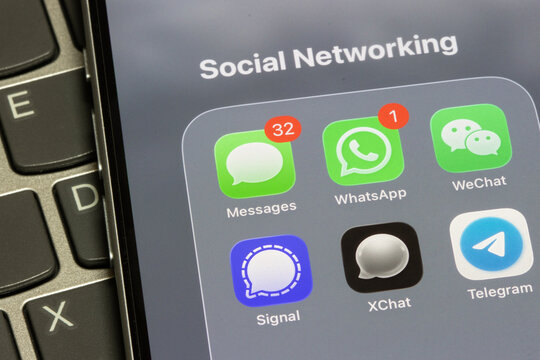 Portland, OR, USA - Apr 27, 2026: Assorted social networking apps, including Apple's Messages, WhatsApp, WeChat, Signal, XChat, and Telegram, are seen on the screen of an iPhone.