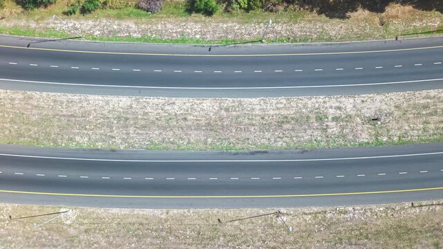 A birds eyeview of a freeway where cars are going in different directions