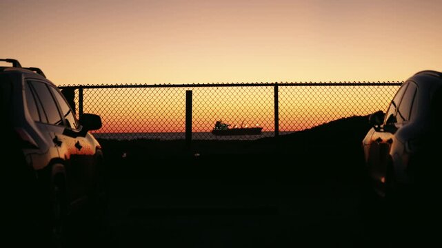 Tanker anchoring on the Pacific Ocean coastline near Manhattan beach at sunset