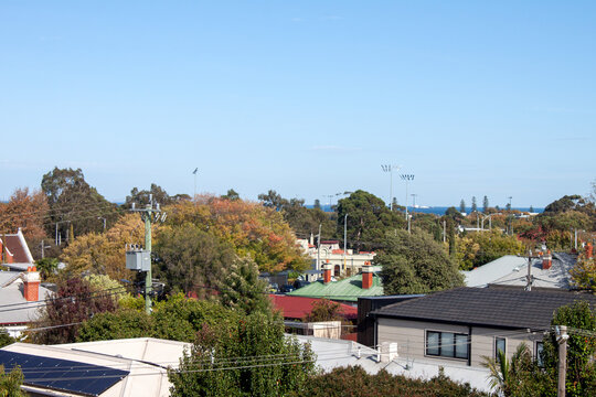 View of houses and buildings including a sports oval; overlooks south-east suburbs of Melbourne, Victoria, Australia
