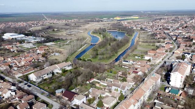 Aerial drone view of Kikinda park with lake and canals, residential neighborhood and fields, Serbia.Staro Jezero, Kikinda, Europe. g.