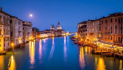 Fototapeta premium Illuminated canal with historic buildings at dusk, full moon above