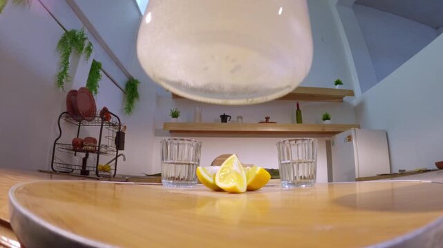 Preparing traditional mexican mezcal with lemon