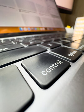 Laptop control key, laptop key, close-up macro photo, black keyboard, laptop, technology, IT, work from home, freelancing, copy space. High quality