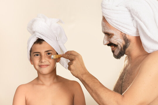 Father and son enjoying a skincare ritual together