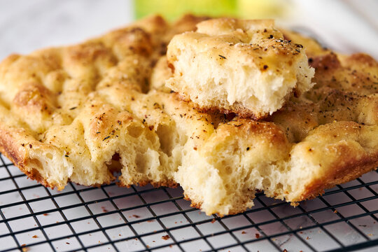Homemade focaccia flatbread with olive oil and herbs