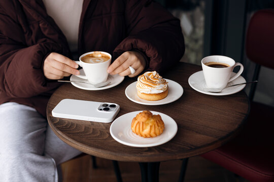 With coffee, pastry, and smartphone, Cozy cafe table