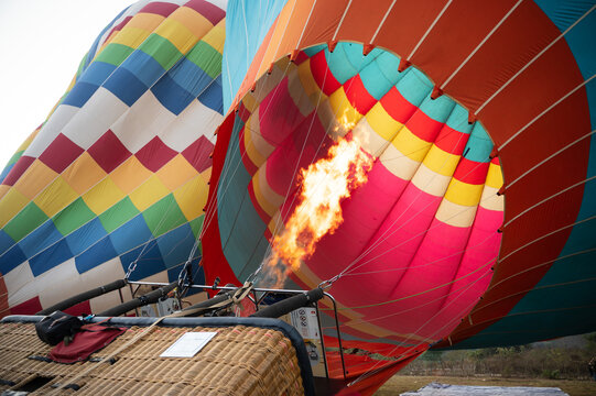 Colorful hot air balloon burner flame during flight prep