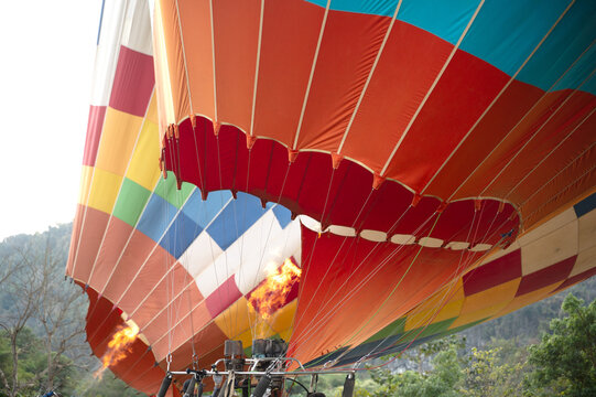 Colorful hot air balloon burner flame during flight prep