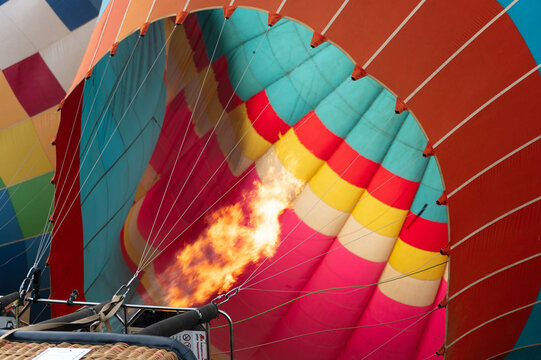 Colorful hot air balloon flame during flight preparation