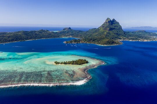 Aerial view of Bora Bora lagoon and tropical island reef