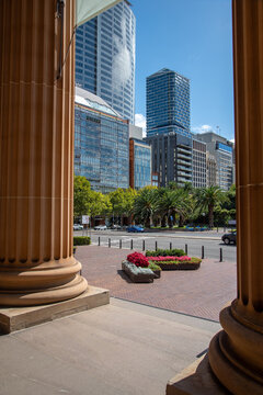 Sydney skyline viewed between columns of the State Library