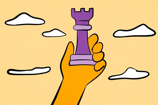 Hand holding chess rook symbolizing business innovation