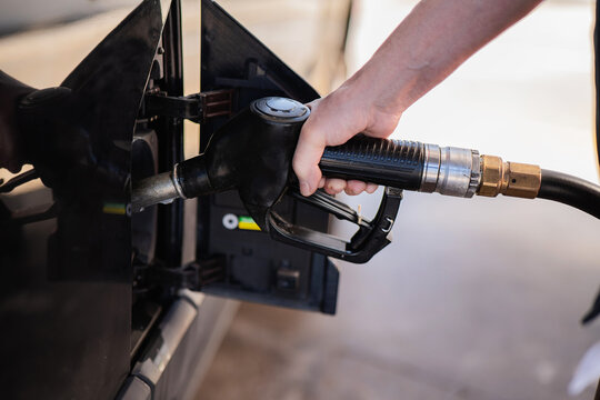 Hand refueling car with gasoline pump nozzle