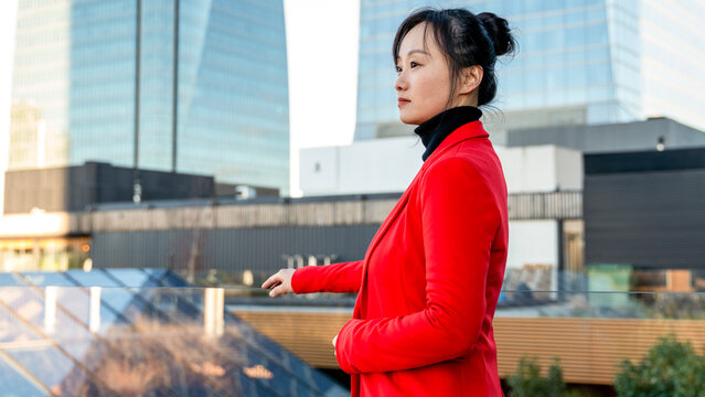 Professional woman in cityscape background