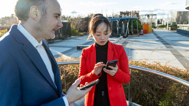 Business professionals discussing outside office