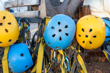 Assorted Colorful Safety Helmets and Harness Equipment Ready for Outdoor Adventure Activity © sandor