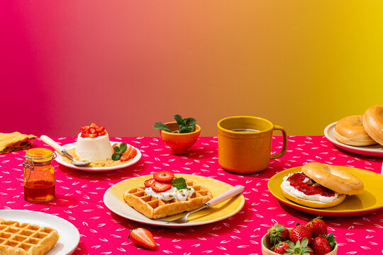 Delicious breakfast spread with bagels and waffles