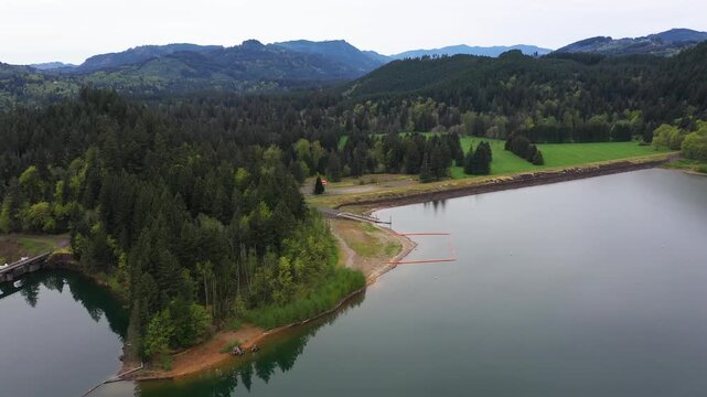 4K aerial drone footage of Yale Lake surrounded by forest in Washington, USA. Calm water, scenic shoreline and Pacific Northwest landscape, ideal for nature background and outdoor scenes