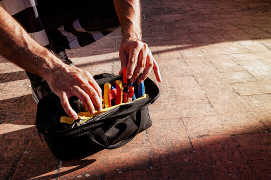 Technician preparing tool bag for safe maintenance work