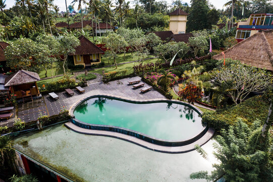 Tropical resort pool and garden in Bali Tegagaland Indonesia